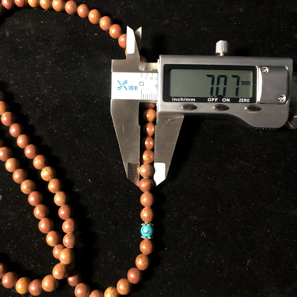 108 bead stone bracelet with geometric hand-polished Lvzhu beads measuring 5-6mm diameter