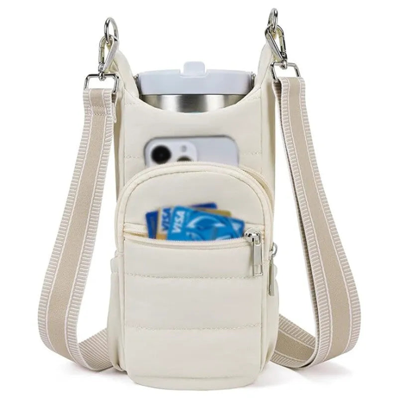 Kettle-shaped cycling water bottle bag in black colour mounted on bicycle handlebars