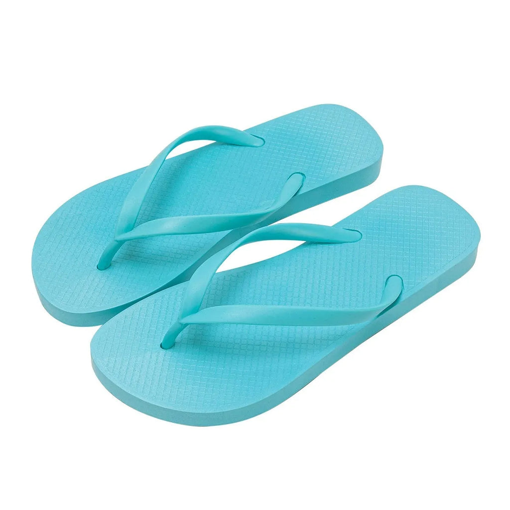 Foldable non-slip beach slippers in orange colour showing hollow-out design and PVC sole.