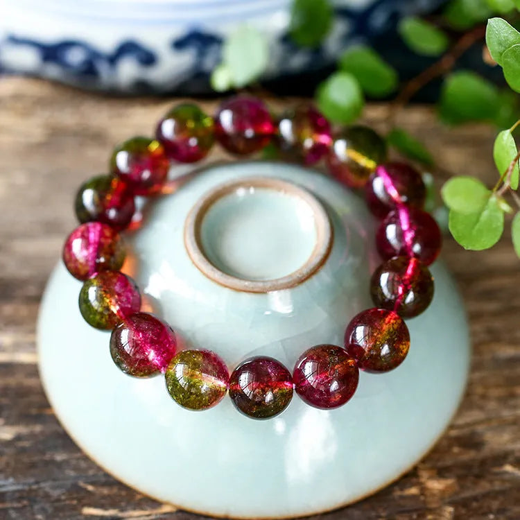 Handmade watermelon crystal bracelet showing pastoral design details on a wrist.