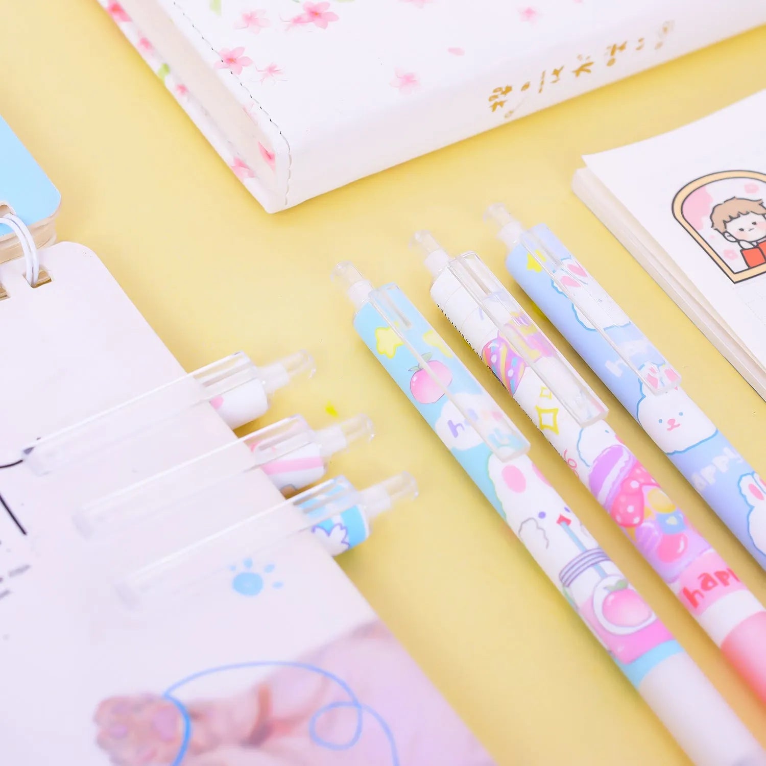 Six black plastic pens with cartoon bunny designs and 0.5mm tips laid side by side.