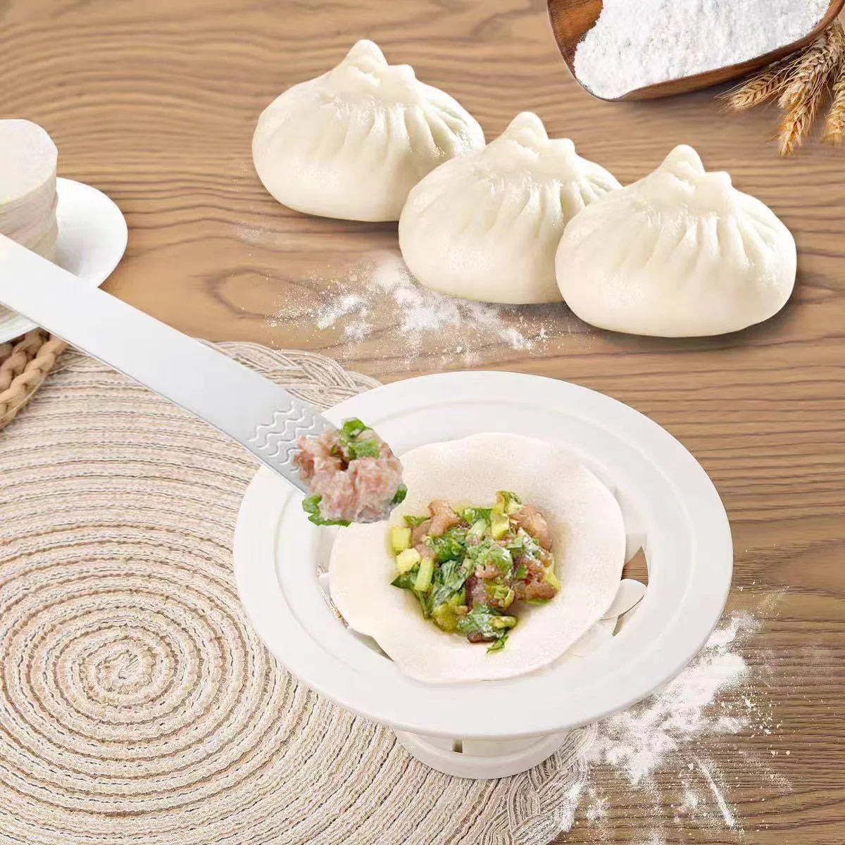 Four black plastic steamed bun moulds for shaping baozi, dumplings, and shumai