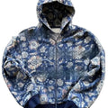 A man's loose fitting blue hooded zip-up coat with long sleeves on a hanger.