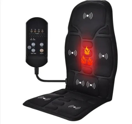 Black electric cervical vertebra massager with wireless remote control on a table.