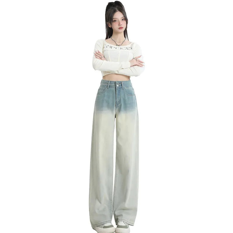 Women's gradient blue denim straight-leg trousers with wide-leg styling on size chart background