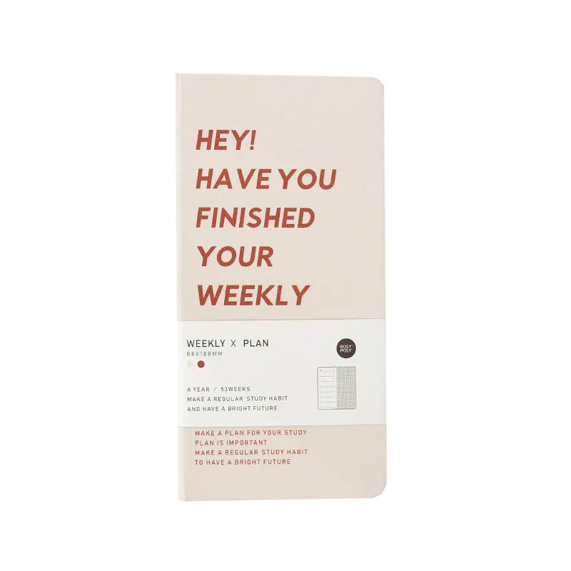 Weekly Plan Diary Handbook with 100 pages in four colour options blue brown green purple on a wooden table