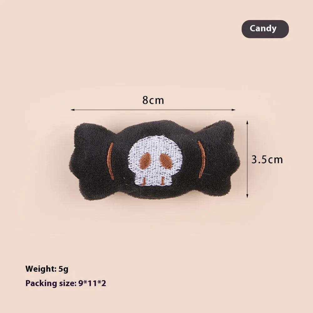 Small plush cat teaser wand with colourful eyes candy skull designs and feathers