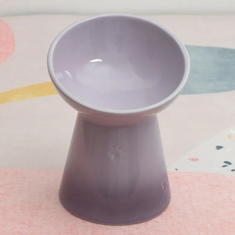 Ceramic pet bowl with high foot design showing anti-tumble stability feature