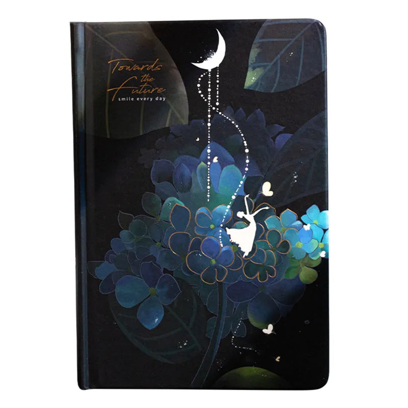 A5 notebook with luminous cover open to show pages filled with colour illustrations