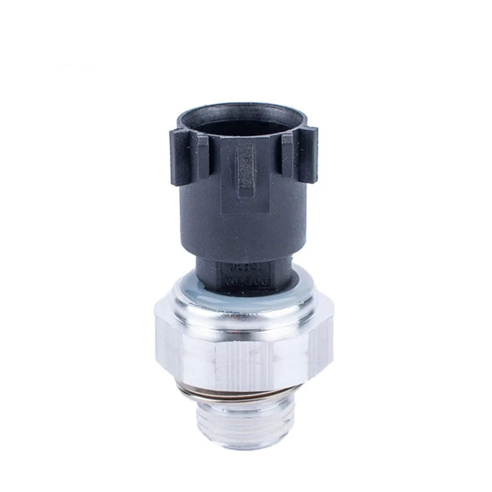 Silver automobile fuel pressure sensor with electrical connector.