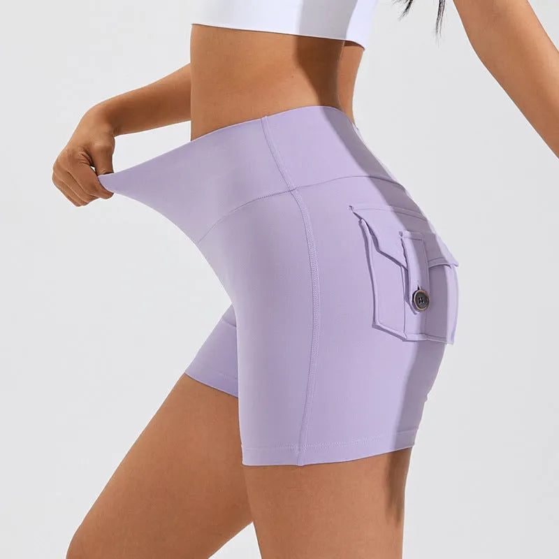 Women's high-waist fitness shorts with pockets in quick-dry nylon fabric, shown in Electric Blue colour
