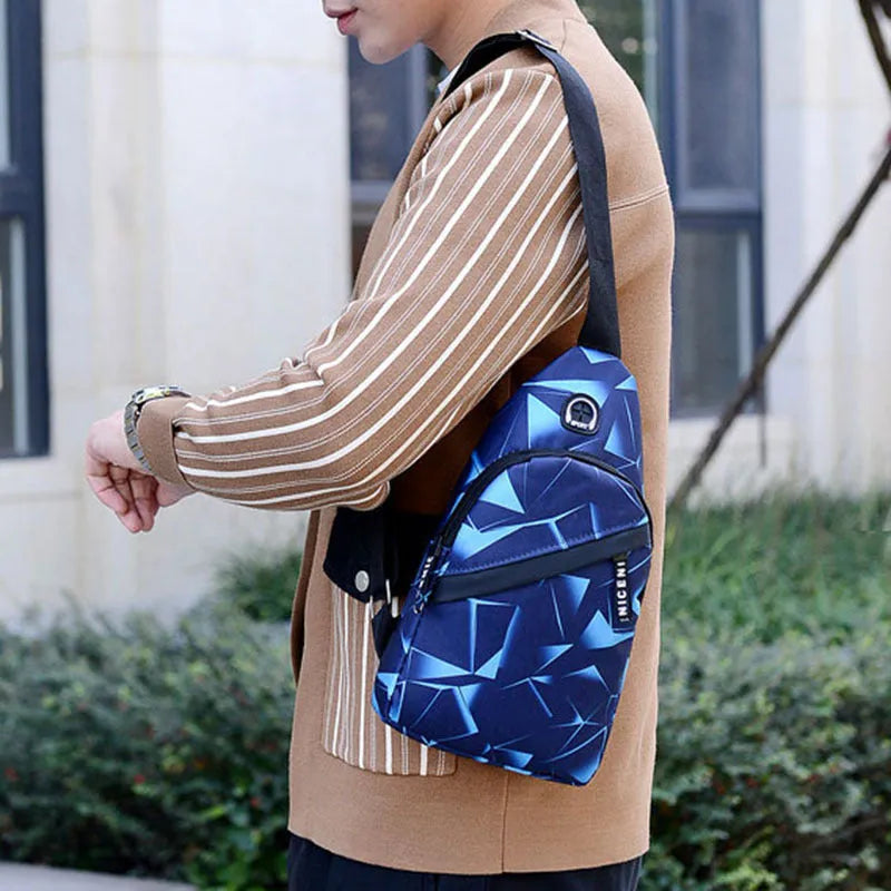 Black print sling chest crossbody bag with earphone hole and zipper pocket.