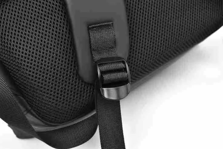 Large black waterproof PU backpack with sewing thread details and separate laptop bag
