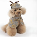 Camel-coloured cotton detective cloak for a dog on a mannequin, showing the hood with adjustable hat.