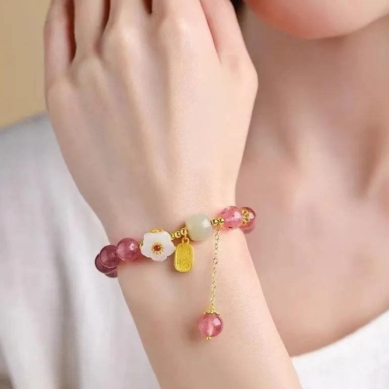 Handmade strawberry quartz crystal bracelet for women showing natural bead designs