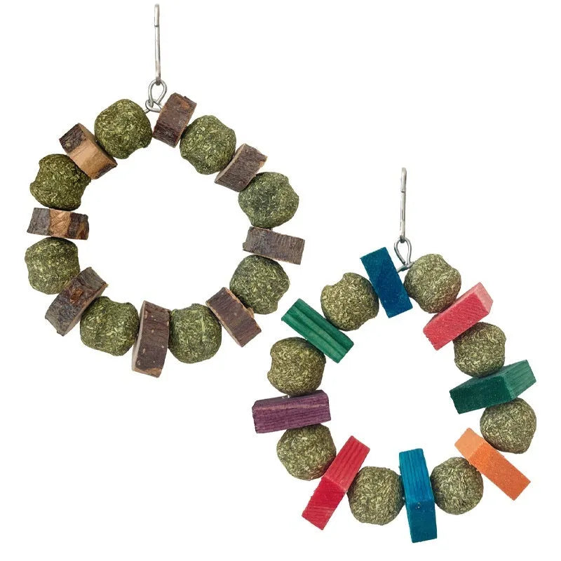 Hamster toy with woven straw ball ring and attached chew rod, shown in two colour variants.