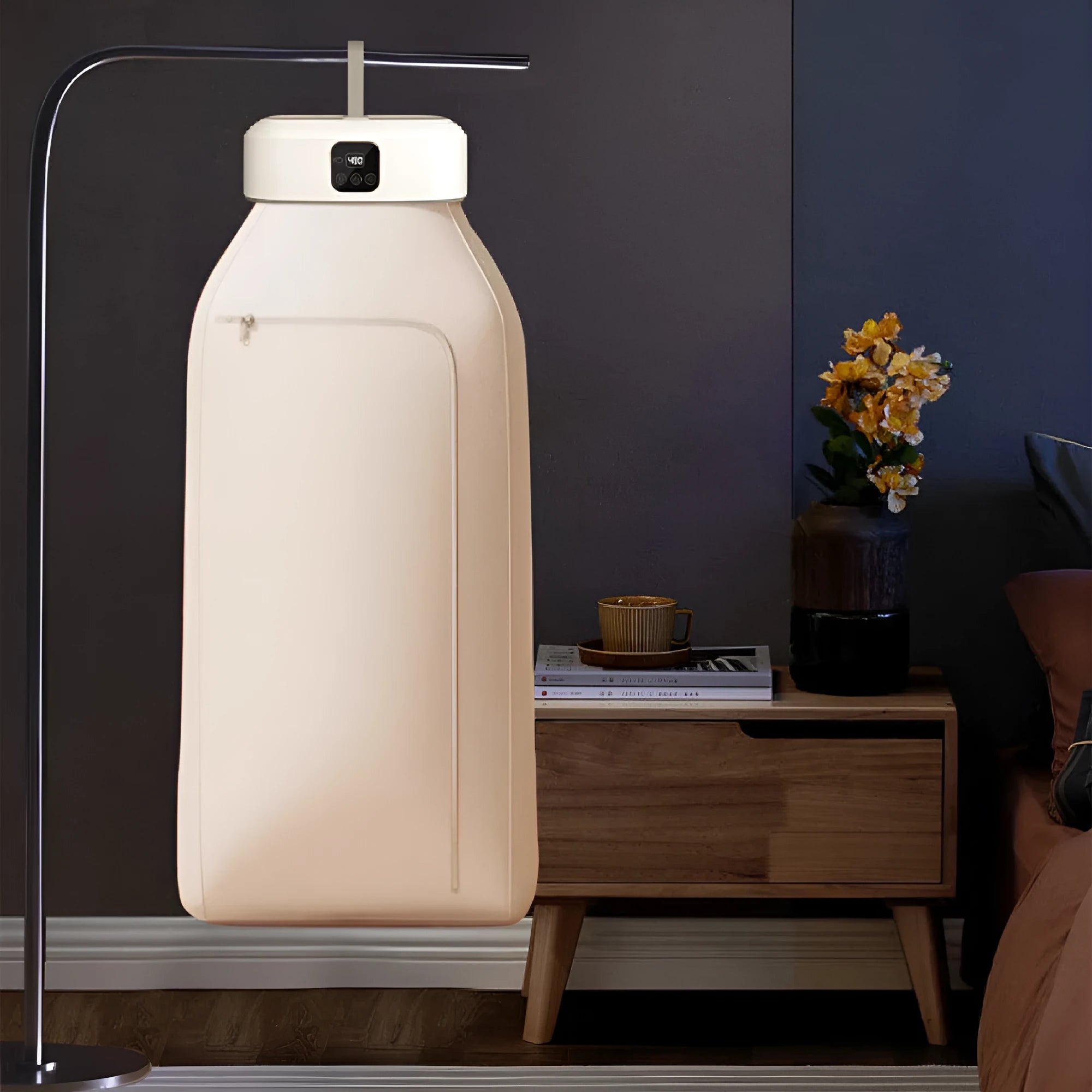 White cylindrical foldable clothes dryer with remote control showing compact 29cm height dimensions