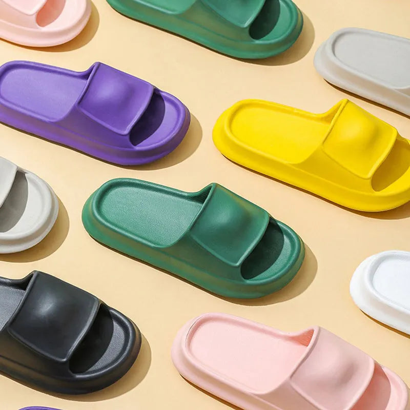 A pair of thick-soled, soft EVA flip-flop slippers with a non-slip tread pattern.