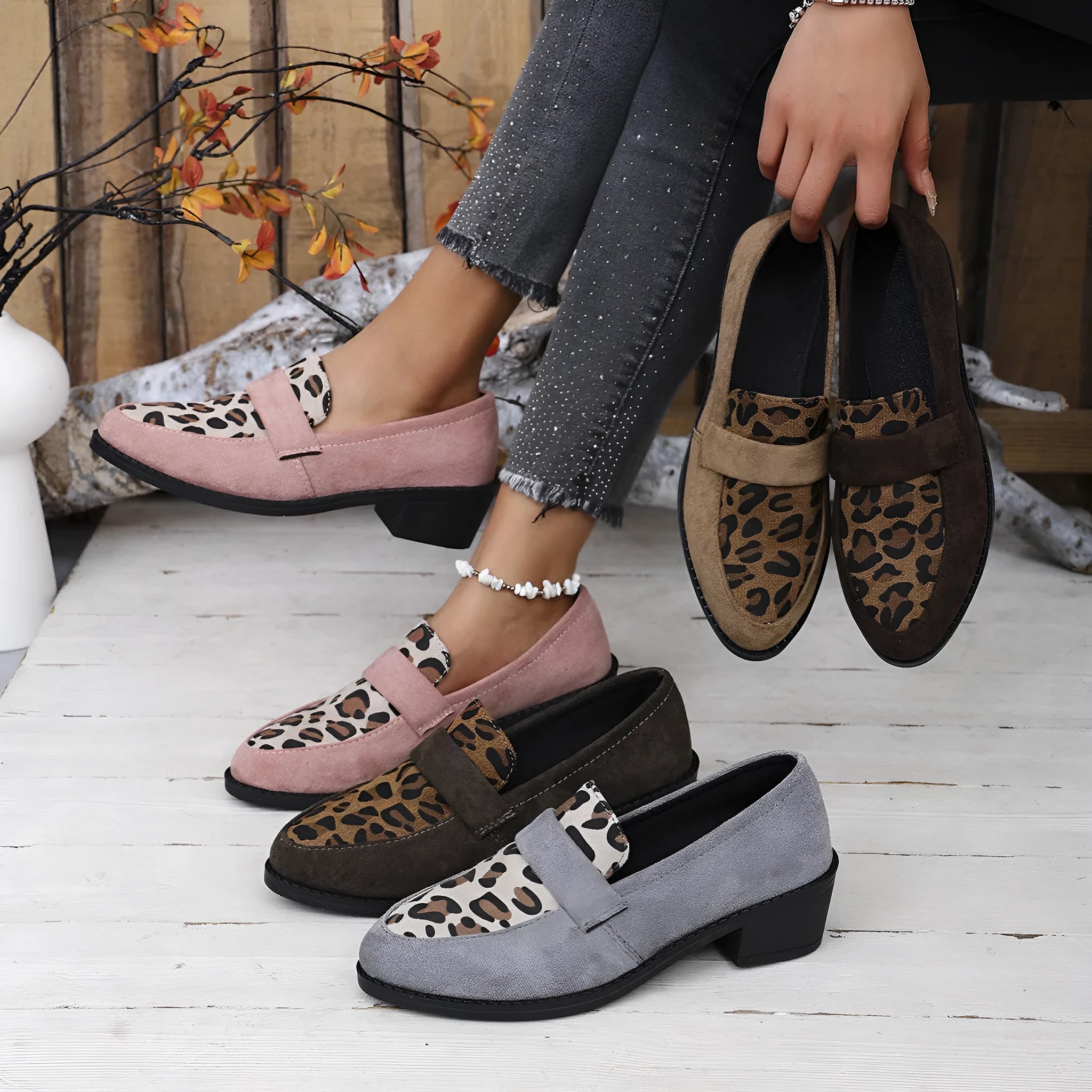 Leopard print suede slip-on shoes with a chunky mid heel and pointed toe on a rubber sole