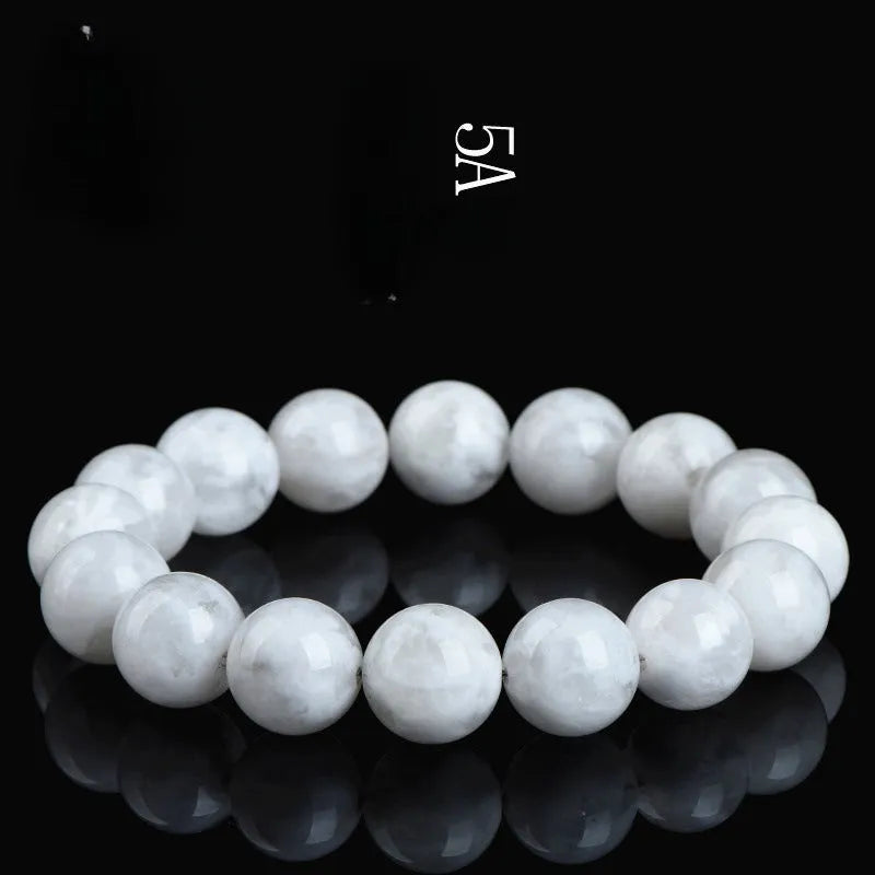 Natural blizzard snowflake crystal bracelet with round beads showing Ruyi and Xiangyun design elements