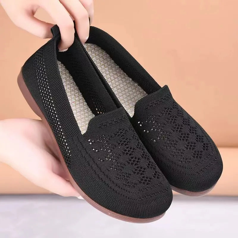 Beige flyknit mesh antiskid trainers for elderly women with wide fit and breathable hollow-out design