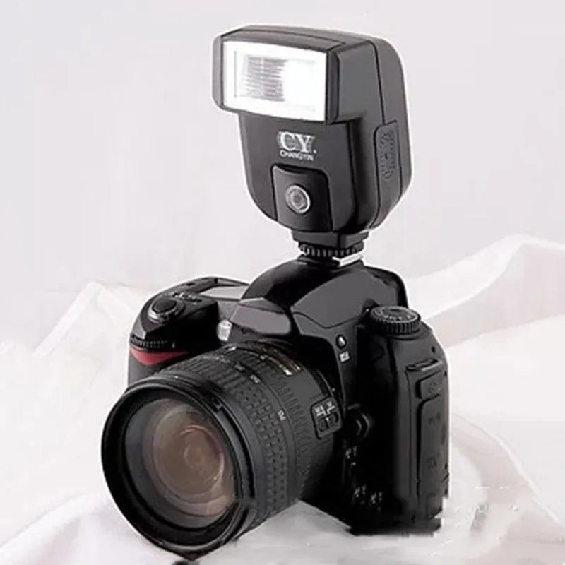 SLR camera flash unit with adjustable tilt head mounted on camera hot shoe