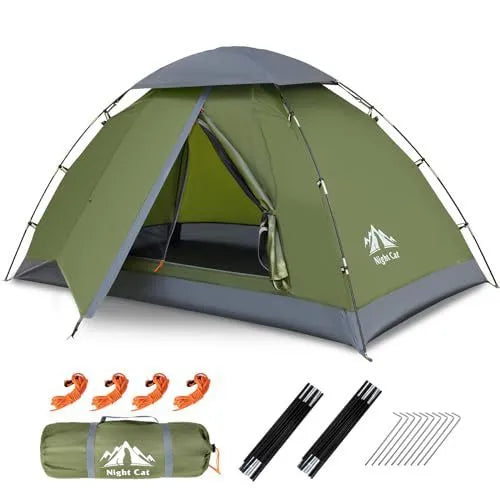 Dark green automatic pop up camping tent pitched outdoors showing waterproof rainfly and compact 2 person size