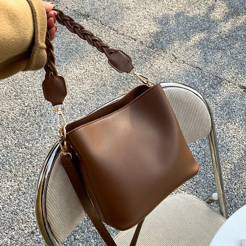 Retro style woven PU crossbody bucket bag in neutral colour
