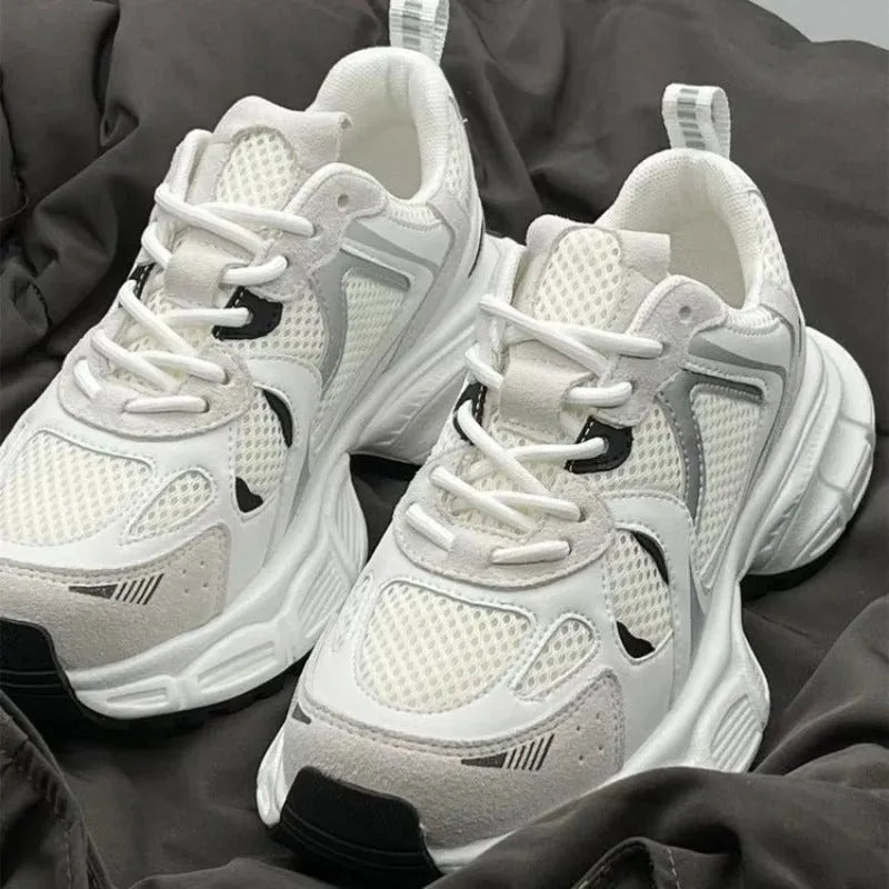 Beige women's mesh platform sports shoes with a wedge heel and lace-up front.