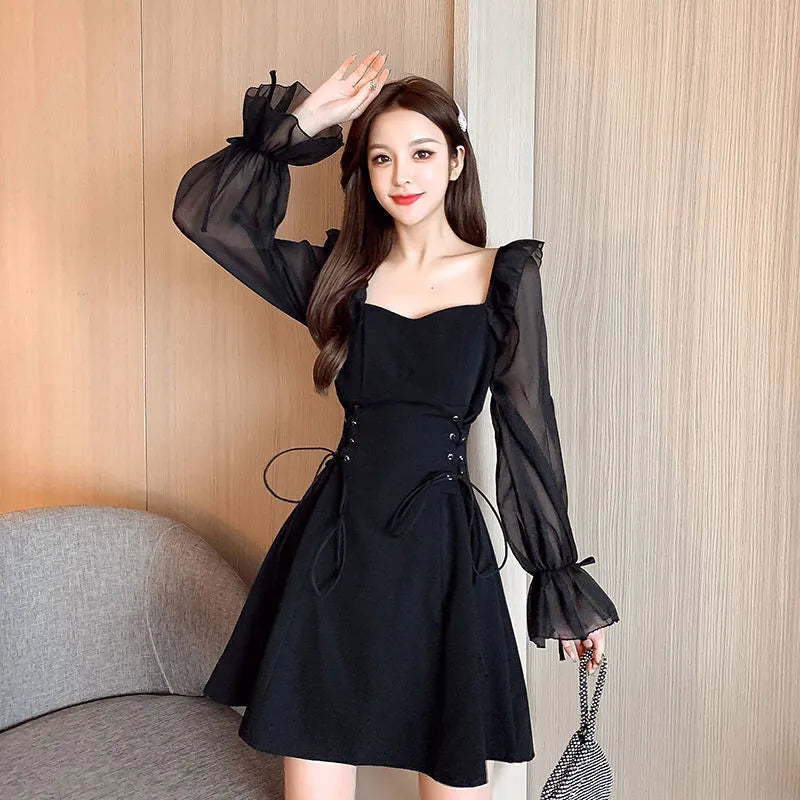 White long sleeve chiffon patchwork dress on a model, showing waist-slimming design and long skirt.