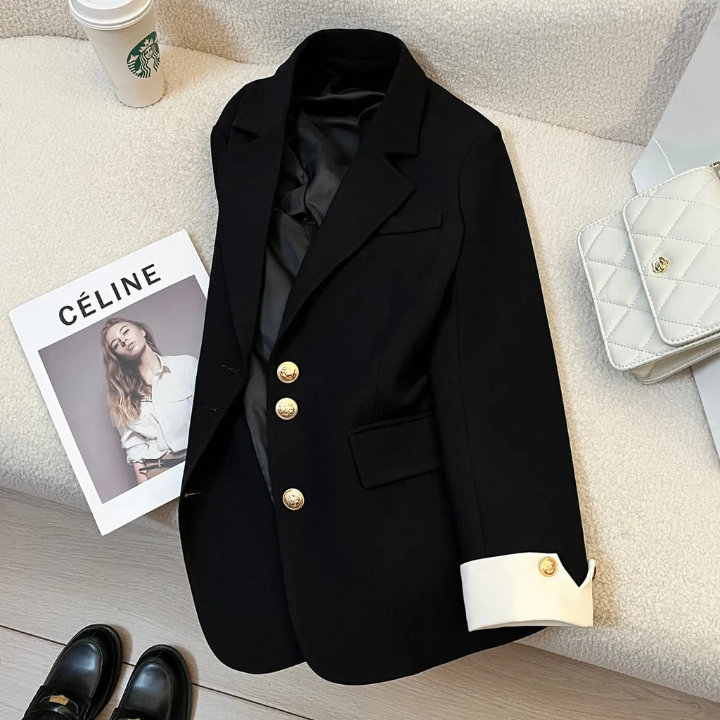 Milky white loose-fit women's trench coat with long sleeves and pockets on a hanger.