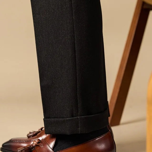 Men's leather tassel loafers in black and brown with polished finish and rubber soles