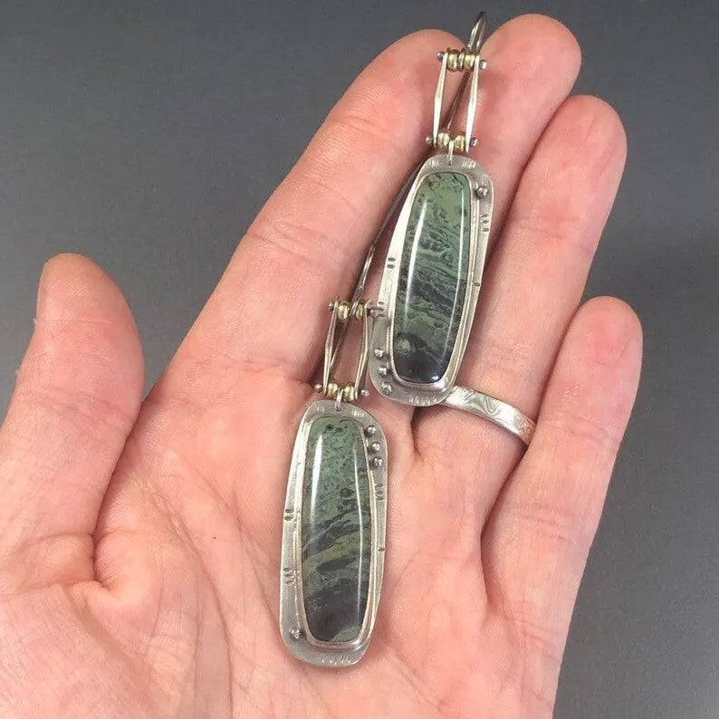 Geometric two-colour marble pattern alloy earrings with simple contemporary design