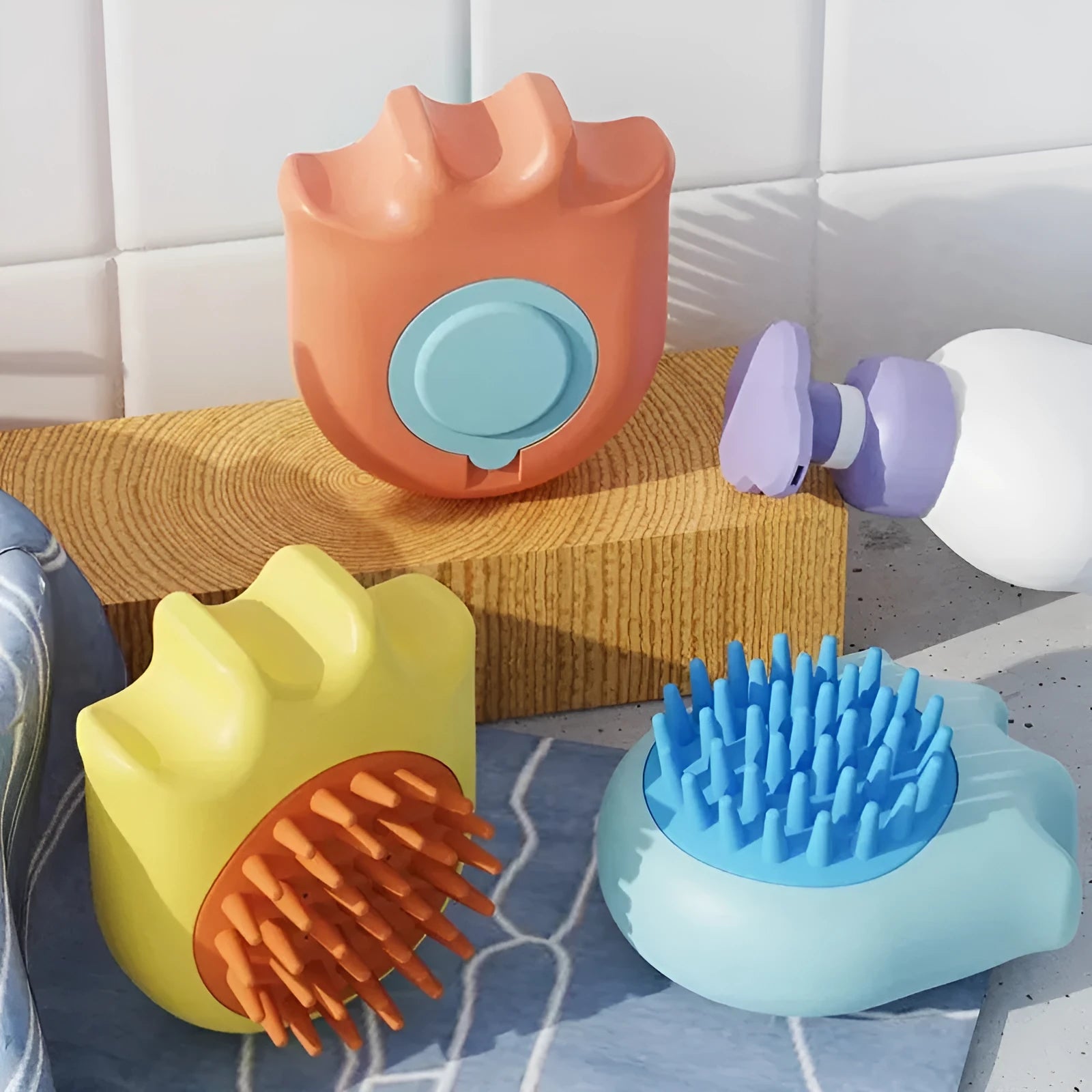 Blue plastic pet bath brush with integrated shampoo box and comb.