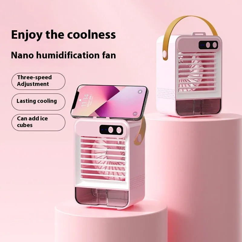 Dark green portable desktop humidifier with USB port on a wooden desk.