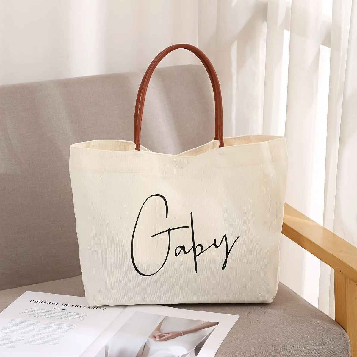 Heavy-duty cotton canvas tote bag with internal pockets, shown in beige white colour.