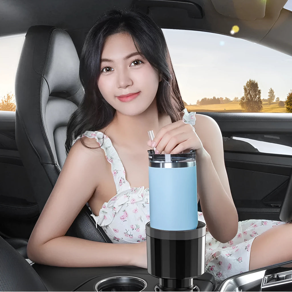 Matte black ABS car cup holder expander with adjustable base for large bottles.