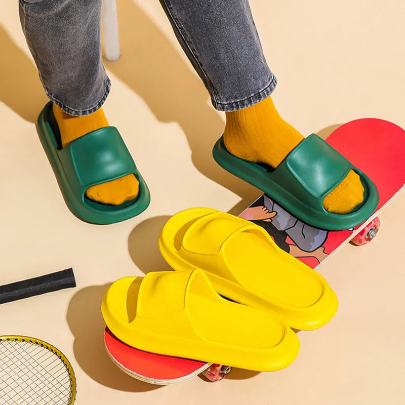 A pair of thick-soled, soft EVA flip-flop slippers with a non-slip tread pattern.