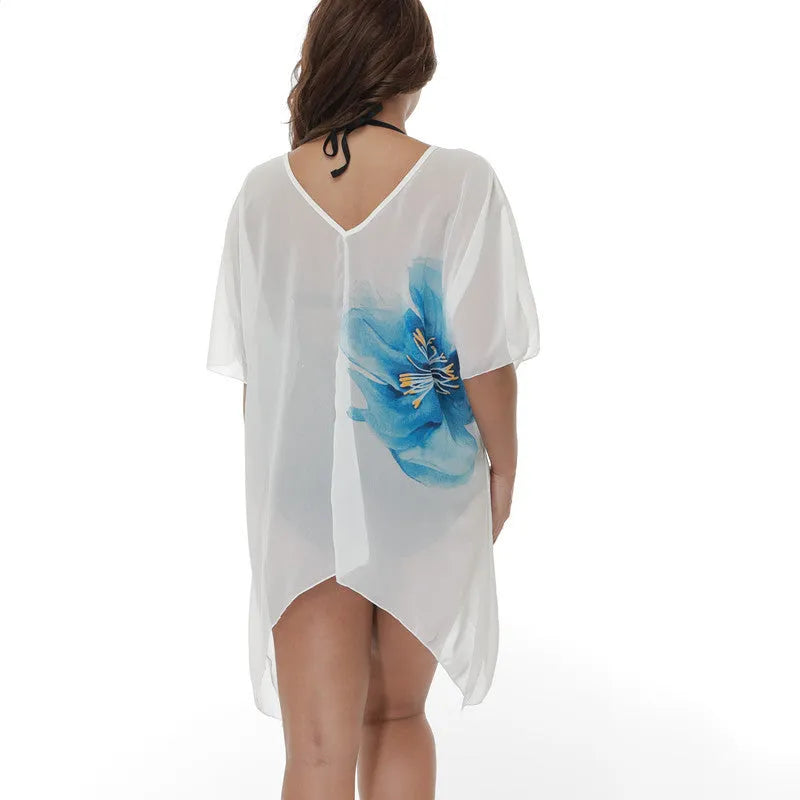 White plus size loose beach cover-up blouse for sun protection over swimwear.