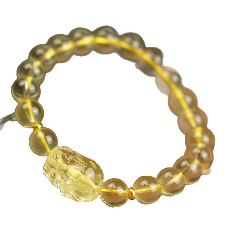 Yellow leather bracelet with a detailed golden citrine Pi Xiu crystal charm.