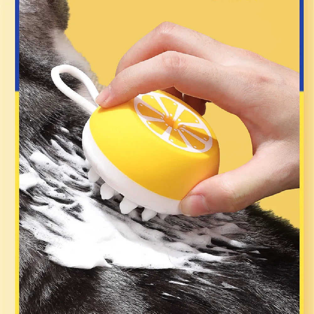 Yellow silicone pet bath brush with massage head and comb for dog and cat grooming.