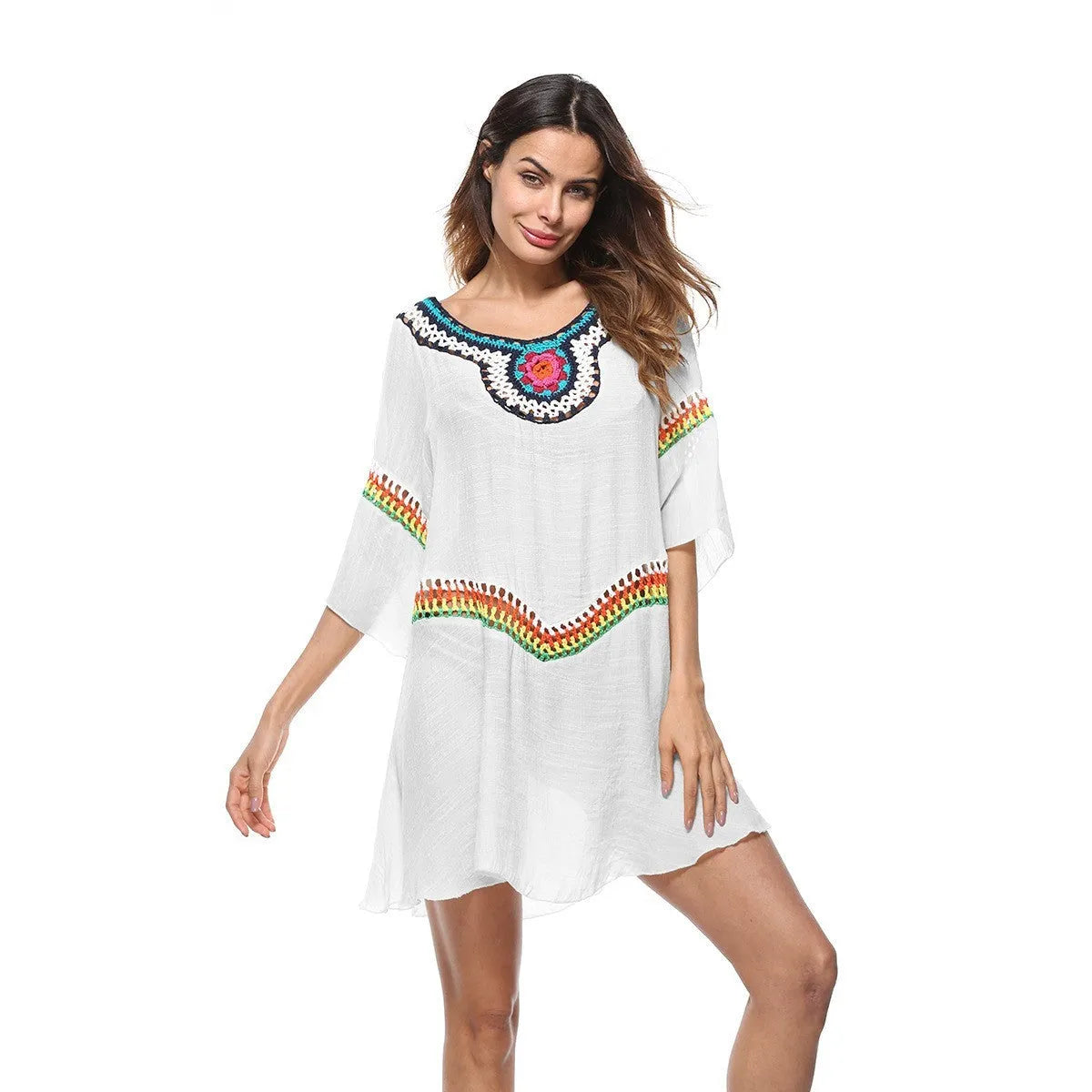 Crocheted ethnic-style white acrylic beach cover-up for women on a mannequin