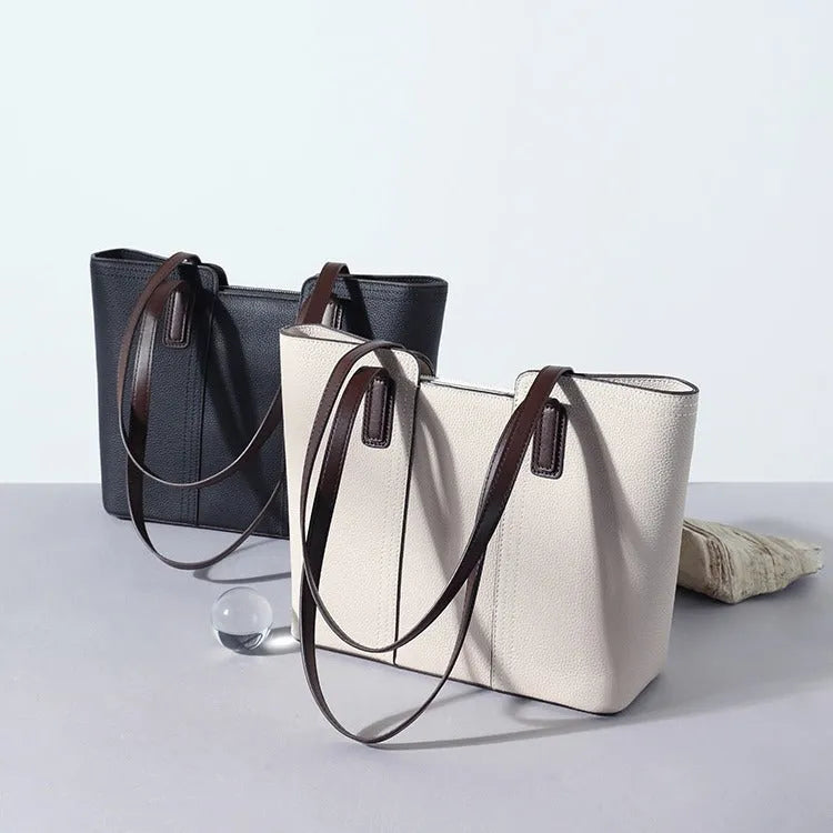 Women's genuine leather commuter shoulder bag in khaki colour showing box-type shape and shoulder strap
