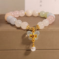 Women's crystal bead bracelet with a colourful natural Morganite stone butterfly pendant.