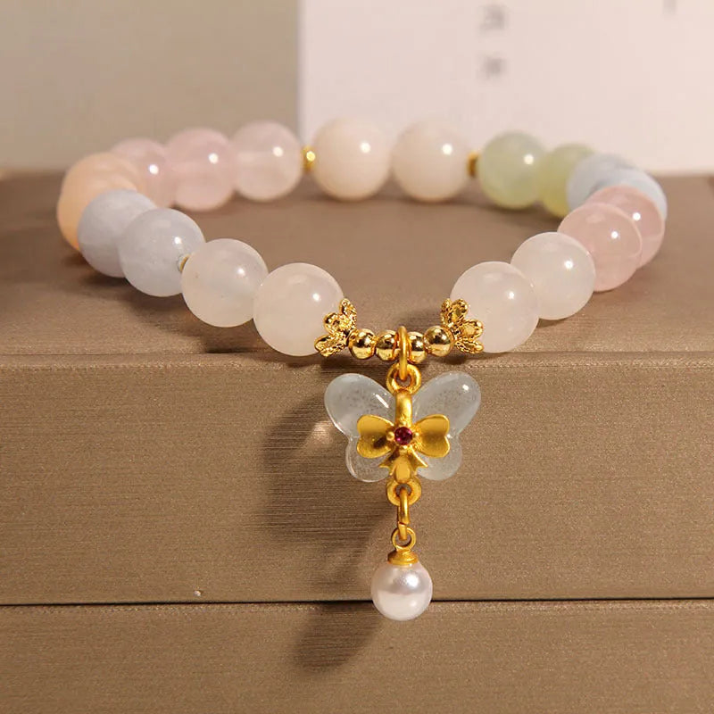 Women's crystal bead bracelet with a colourful natural Morganite stone butterfly pendant.