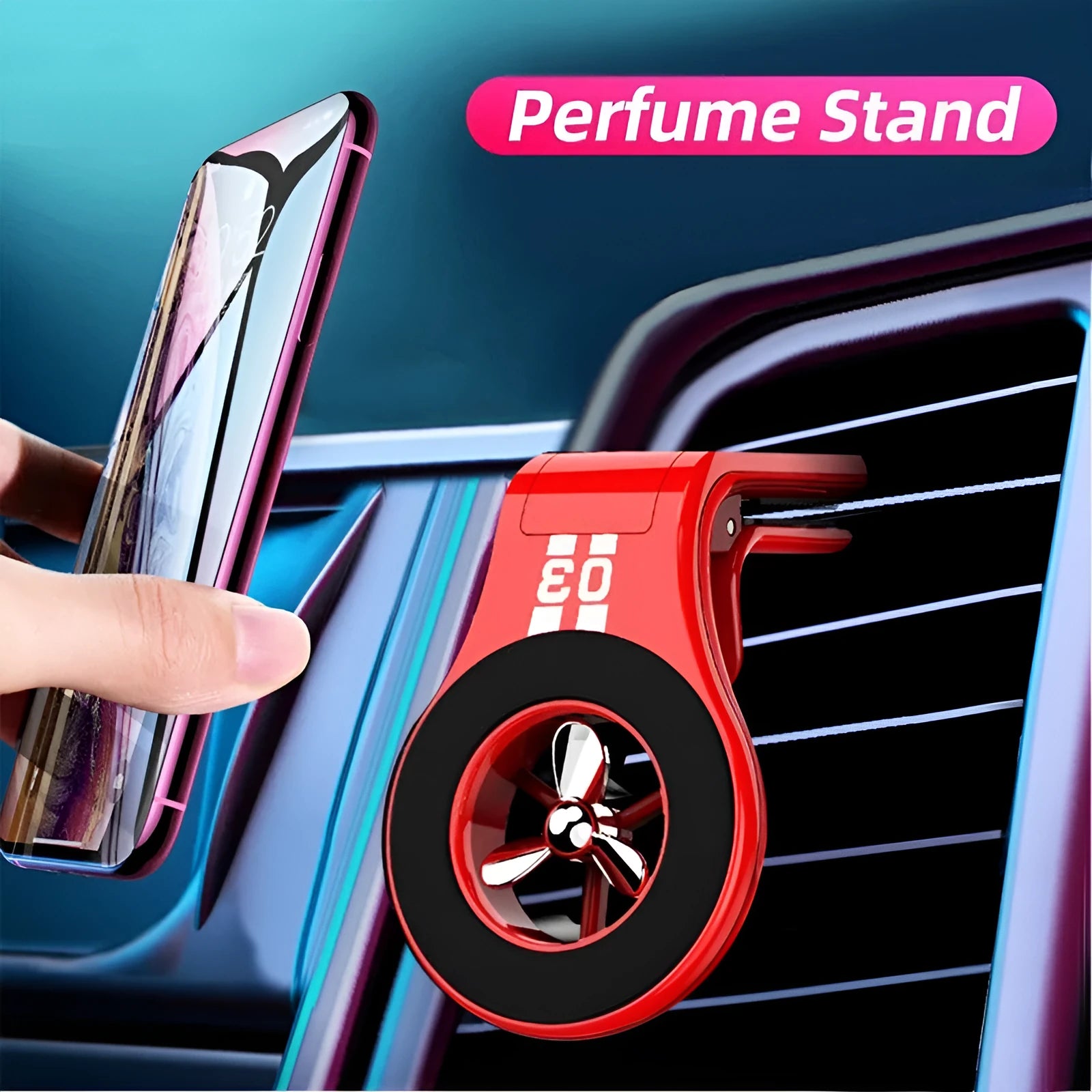 Black magnetic car phone holder clipped to a car air vent, holding a mobile phone, with a fragrant slice inserted.