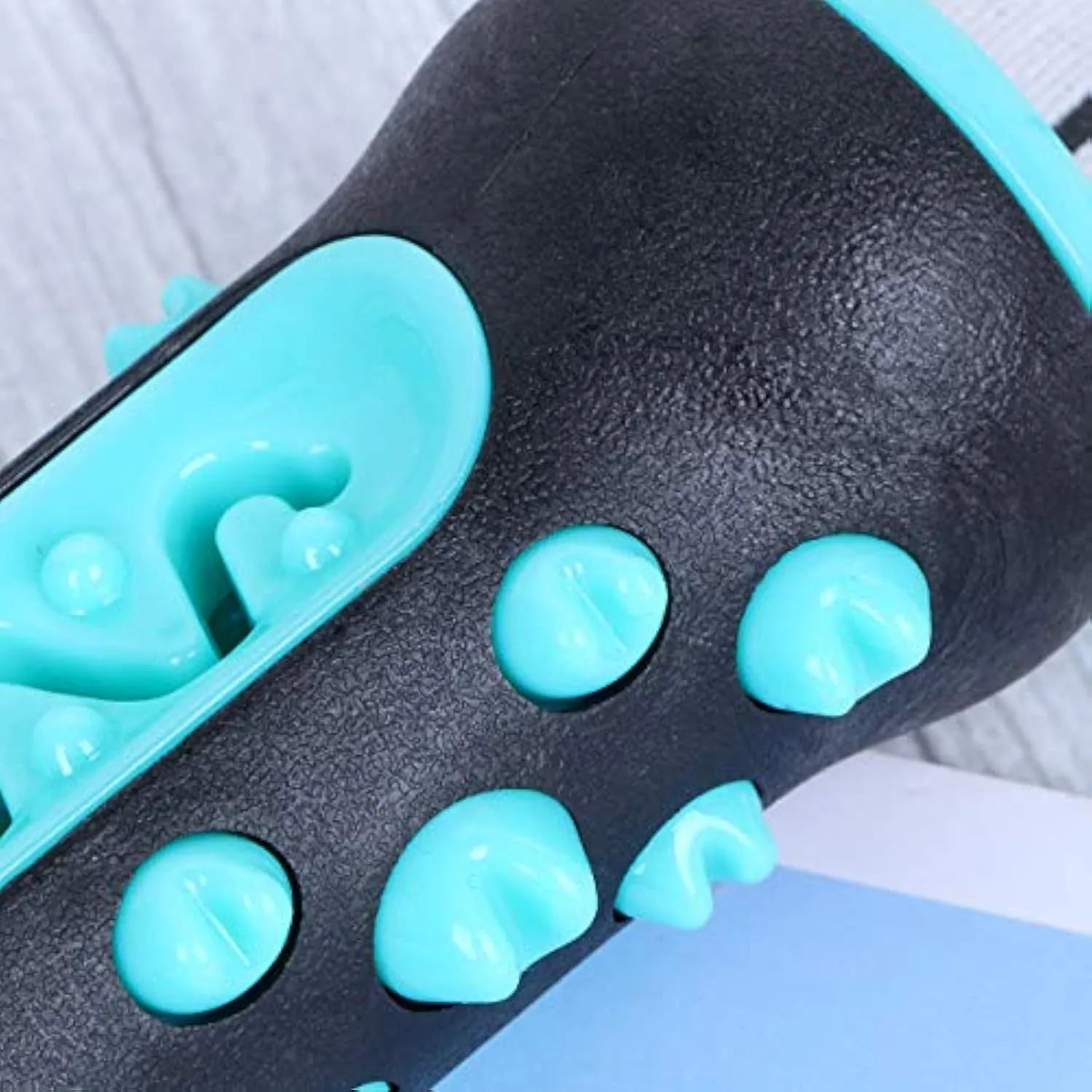 Natural rubber dog toothbrush chew toy in blue, showing textured surfaces and measuring 15 cm long.