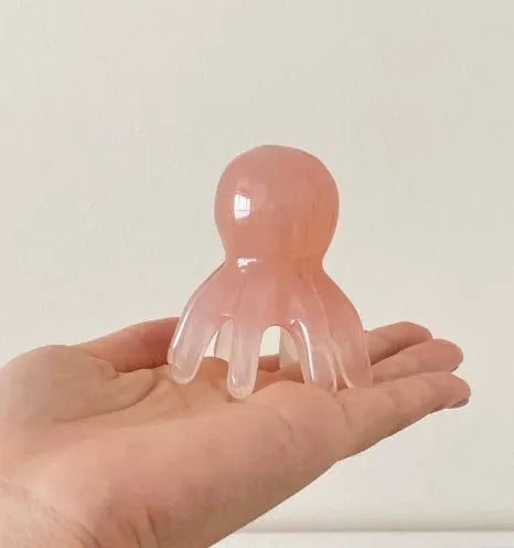 Pink natural resin octopus massage comb for periocular meridian and facial massage with storage bag