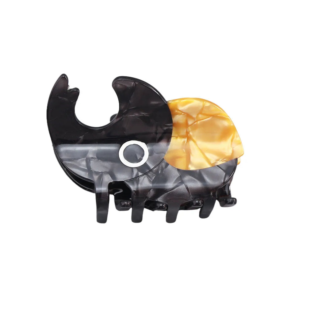 Handmade cellulose acetate Beetle Grip educational tool showing cartoon beetle and caterpillar designs