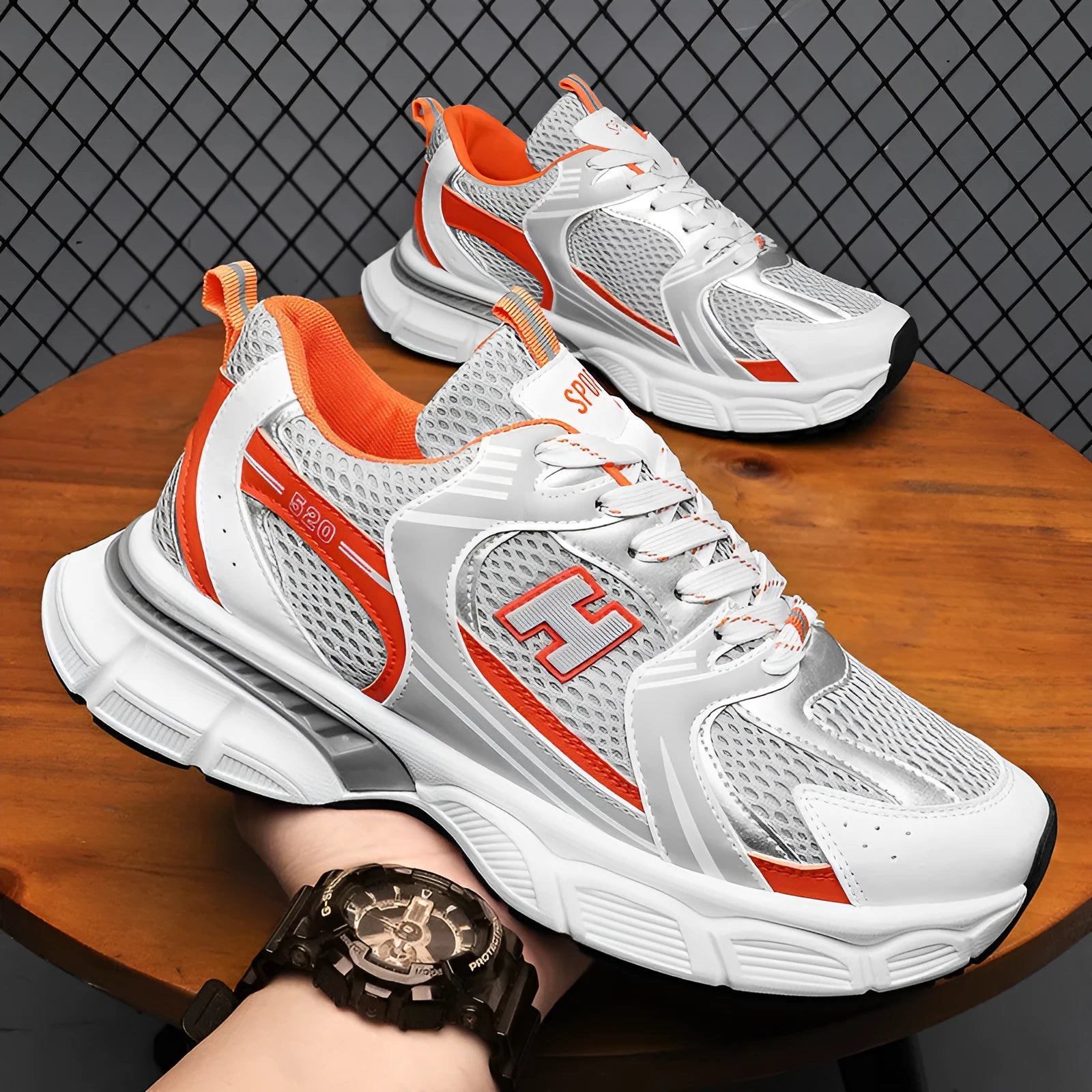 Men's black and white mesh casual running shoes with a round toe and plastic sole.